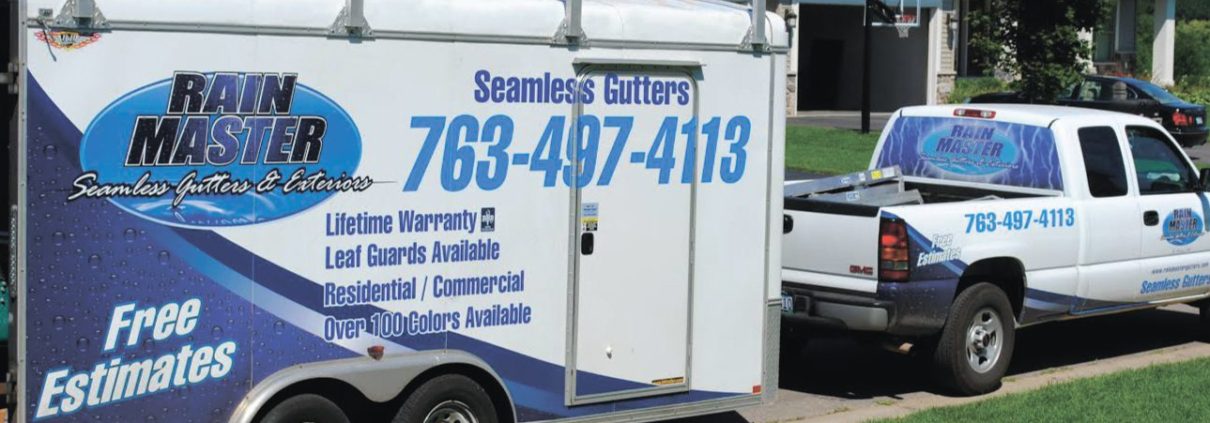 white truck and trailer with Rain Master branding - Rain Master Seamless Gutters