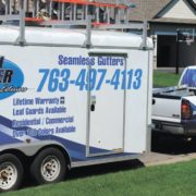 RainMaster-seamless-gutters white truck and trailer with Rain Master branding - Rain Master Seamless Gutters