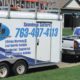 white truck and trailer with Rain Master branding - Rain Master Seamless Gutters