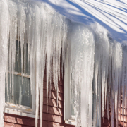 large icicles hanging from roof and gutters - Rain Master Seamless Gutters