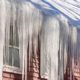 large icicles hanging from roof and gutters - Rain Master Seamless Gutters