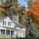 exterior of a home with multiple trees - Rain Master Seamless Gutters