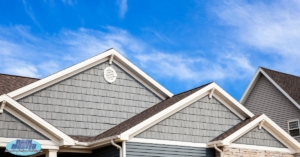 blue house with white gutters - Rain Master seamless gutter installation