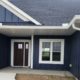 blue house with white seamless gutters - Rain Master seamless gutters