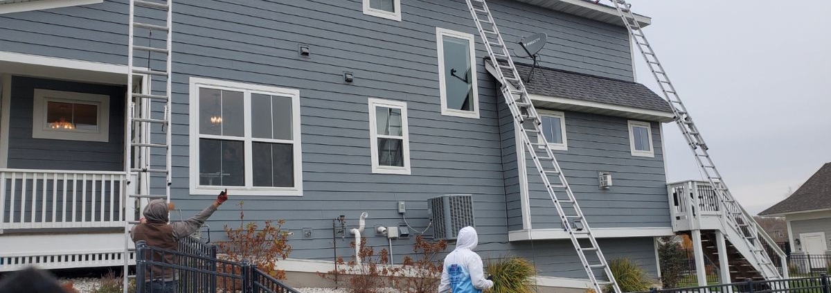 tall ladder leaning against home - Rain Master Seamless Gutters gutter installation