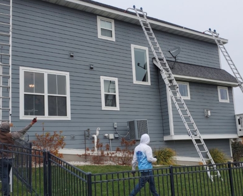 tall ladder leaning against home - Rain Master Seamless Gutters Professional gutter repair MN