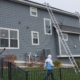 tall ladder leaning against home - Rain Master Seamless Gutters Professional gutter repair MN