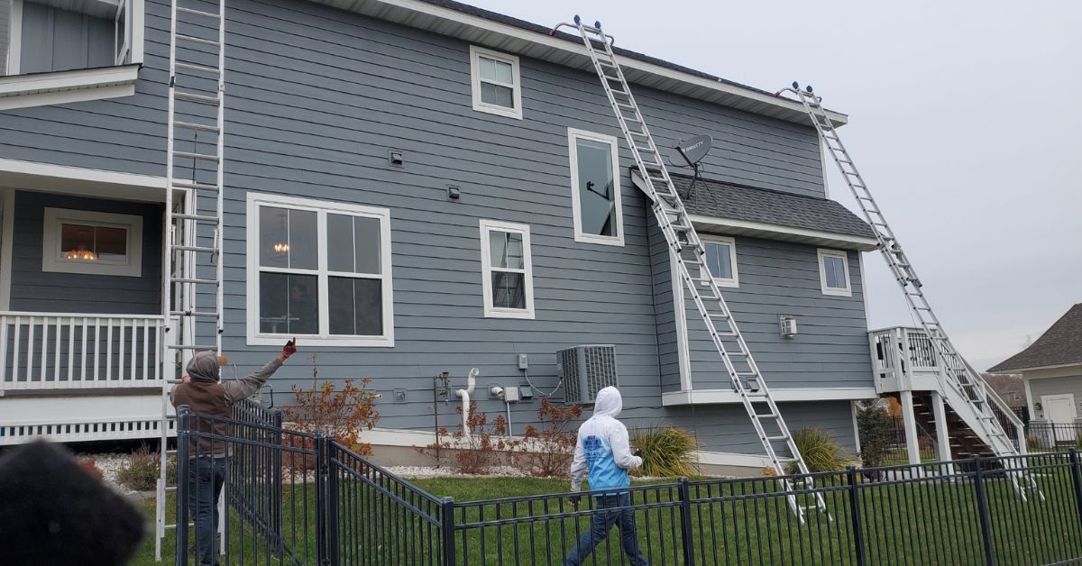 grey house with installed seamless gutters - Rain Master seamless gutter installation near Apple Valley
