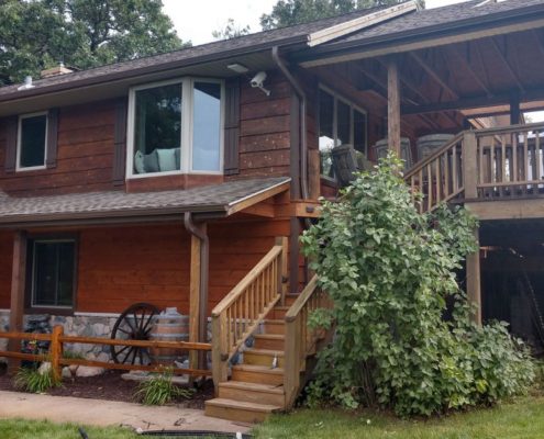 house with brown seamless gutters - Rain Master seamless gutters