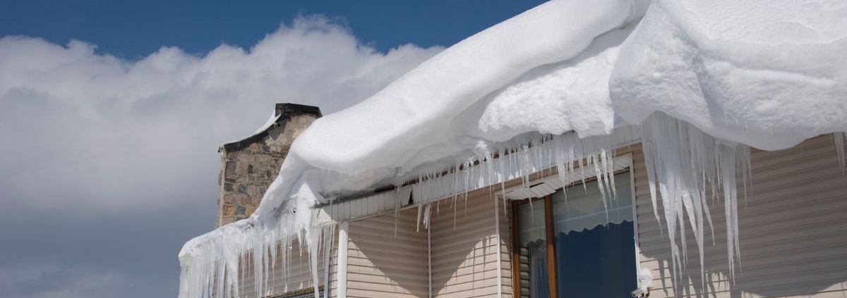 house with ice dams on roof - Rain Master seamless gutters Home Maintenance