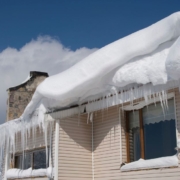 house with ice dams on roof - Rain Master seamless gutters Home Maintenance