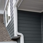 close up of a white seamless gutter - Rain Master seamless gutter Gutter Material