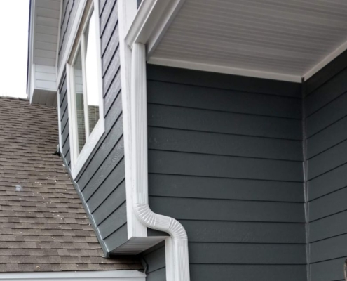 close up of a white seamless gutter - Rain Master seamless gutter Gutter Material