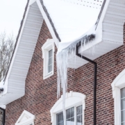 RainMaster-seamless-gutters-111420241 red brick house with ice dams - Rain Master seamless gutters Home Maintenance