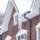 red brick house with ice dams - Rain Master seamless gutters Home Maintenance