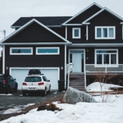 house in the winter with bright white trim work - Rain Master seamless gutters