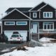 house in the winter with bright white trim work - Rain Master seamless gutters