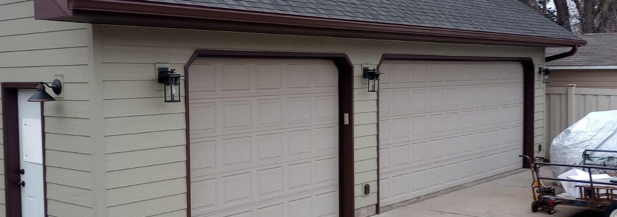 house with dark brown seamless gutters - Rain Master gutter replacement