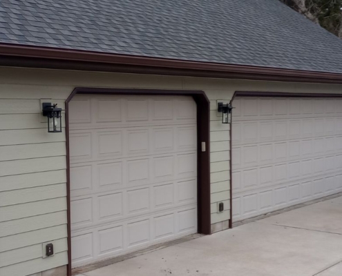 house with dark brown seamless gutters - Rain Master gutter replacement