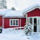 exterior of a red home in the winter - Rain Master Gutter Material