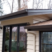 exterior of a home with dark brown gutters - Rain Master 2026 Gutter Trends