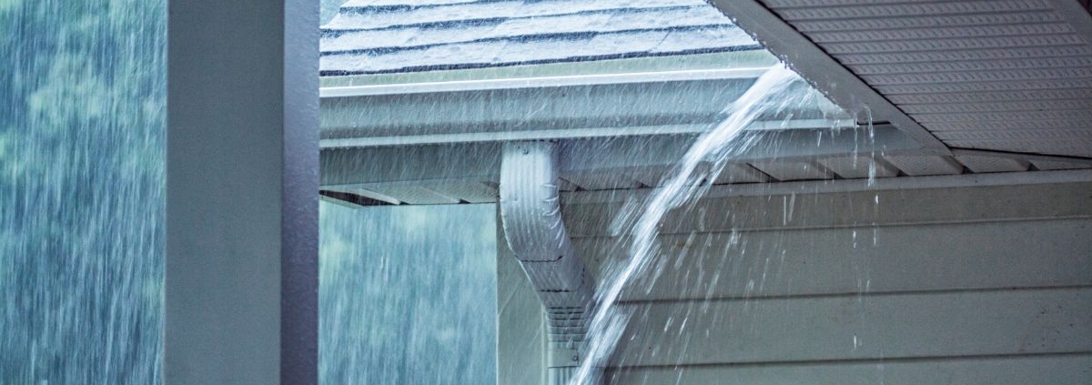heavy rain storm with water on the roof - Rain Master seamless gutter installation