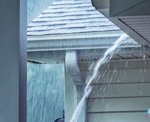 heavy rain storm with water on the roof - Rain Master seamless gutter installation