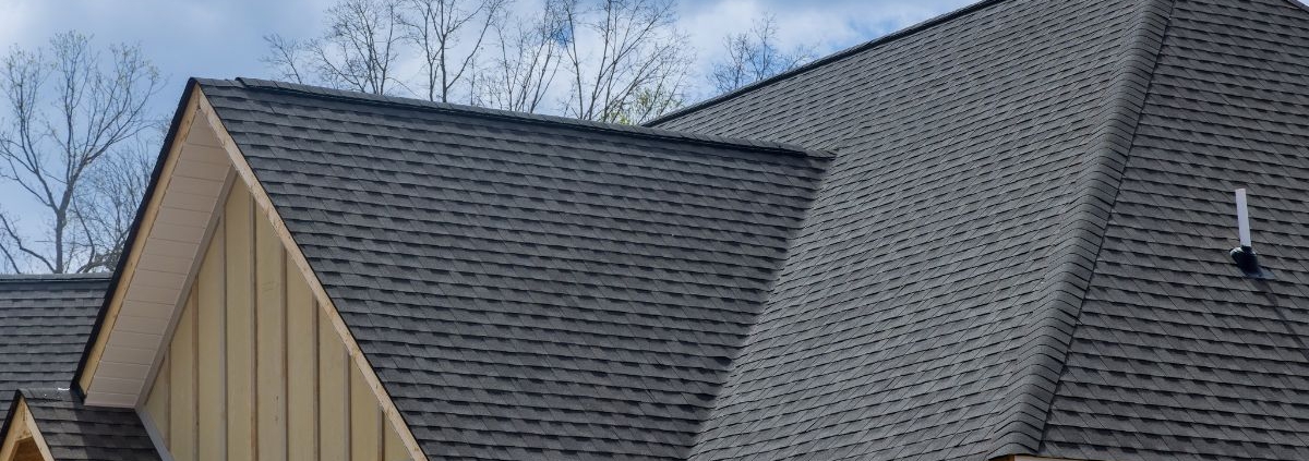 close up of a roof with grey shingles - Rain Master seamless gutter installation