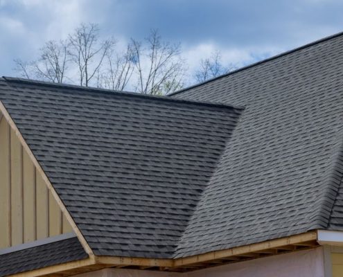 close up of a roof with grey shingles - Rain Master seamless gutter installation