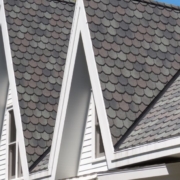 close up of a roof with grey shingles - Rain Master seamless gutter installation