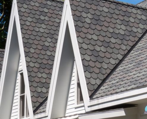 close up of a roof with grey shingles - Rain Master seamless gutter installation