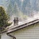 exterior of home roof during a rain storm - Rain Master Gutter installers near St. Paul