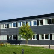 RainMasterSeamlessGutters-commercial-gutter-installation-071020251 exterior of a commercial office building - Rain Master Seamless Gutters