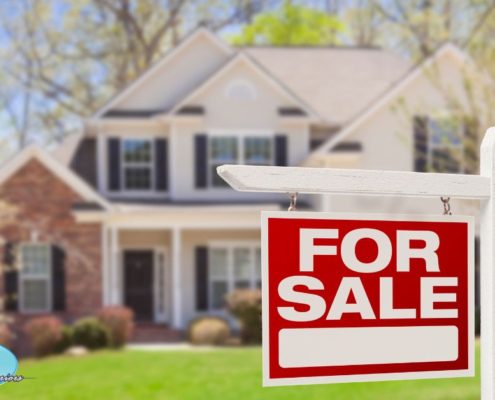 large two story home with a for sale sign out front - Rain Master seamless gutter installation