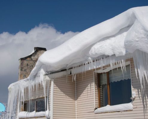 edge of a roof with icicles and snow hanging off - Rain Master Seamless Gutters Fixing Sagging Gutters