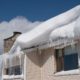 edge of a roof with icicles and snow hanging off - Rain Master Seamless Gutters Fixing Sagging Gutters