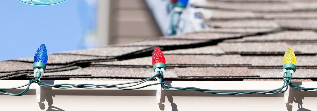 close up of multi colored holiday lights on gutters - Rain Master hanging Christmas lights