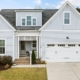 exterior of a newly built home - Rain Master Seamless Gutters Color-Matched Gutters