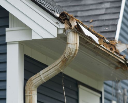 exterior of a home with significant gutter damage - Rain Master Seamless Gutters insurance claims for gutter damage in Minnesota